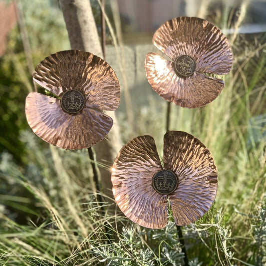 copper poppy with button centre featuring crown